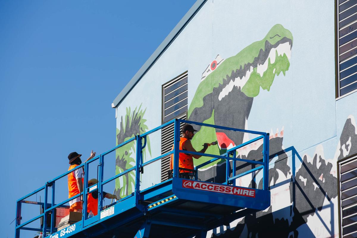 "The ‘Boxing Croc’ image, from Red Hand Prints, represents a time in the late 80’s when Franck's best mate’s mum owned a small takeaway shop at Humpty Doo. They would go and help out sometimes and imagine that the Boxing Croc was their own Territory version of Godzilla. In Japanese culture Godzilla was a metaphor for the USA and the fears of nuclear devastation brought on by the events at Hiroshima and Nagasaki. Also at that time American B-52 bombers were landing in Darwin for military exercises with undis